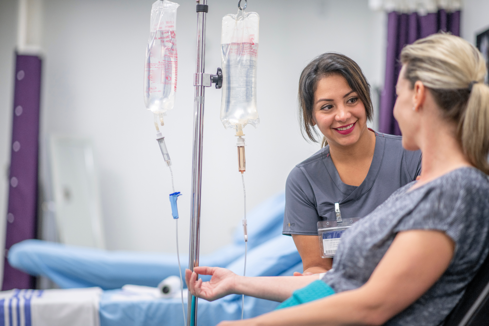 Registered Nurse with a guest during a stem cell IV infusion at iCRYO Clifton Park